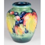 Moorcroft vase decorated in the Leaf and Berry pattern, height 9cm