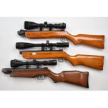 Three various air rifle stocks, all mounted with scopes comprising Nikko Stirling Mountmaster 3-9x50