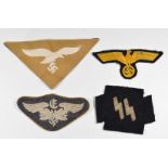 Four replica Nazi cloth badges