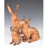 Three Winstanley Pottery hares, number 2, 5 and 9, tallest 37cm