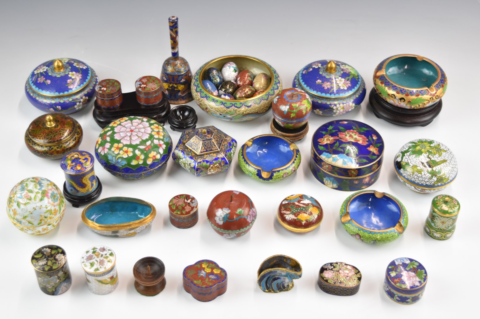 A collection of Chinese cloisonné covered pots, dishes, bell etc, largest diameter 12cm