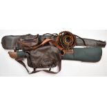 A collection of shotgun accessories comprising two padded or wool lined gun slips, a leather