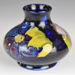 Moorcroft squat pedestal vase decorated in the Anemone pattern, height 8cm