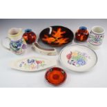 A collection of Poole pottery including a charger decorated in Autumn Leaves pattern