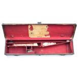 Leather and canvas bound shotgun carry case with remnant of original label, 76 x 18 x 8cm.