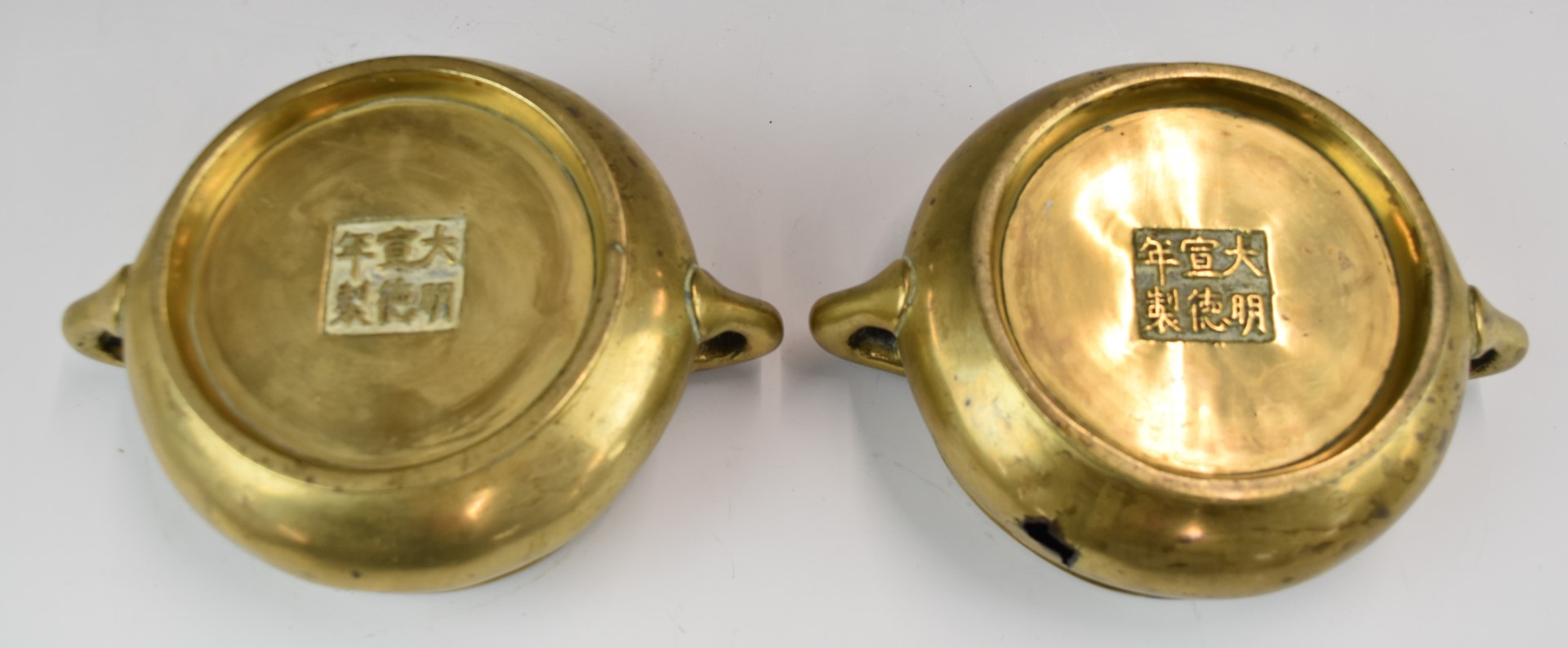 A pair of Chinese 19th / 20thC twin handled pedestal bronze censers with six character marks to - Image 3 of 3