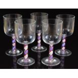 A set of five Steve Bradley drinking glasses with red, white and blue coloured twist stems, signed