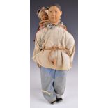 Chinese 'Door of Hope' doll wearing blue trousers and white jacket and with a baby on their back,