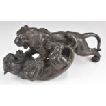 Japanese bronze of two tigers fighting with impressed mark to base, length 32 x height 15cm