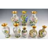 Eight Chinese cloisonné vases including three pairs, tallest 22cm