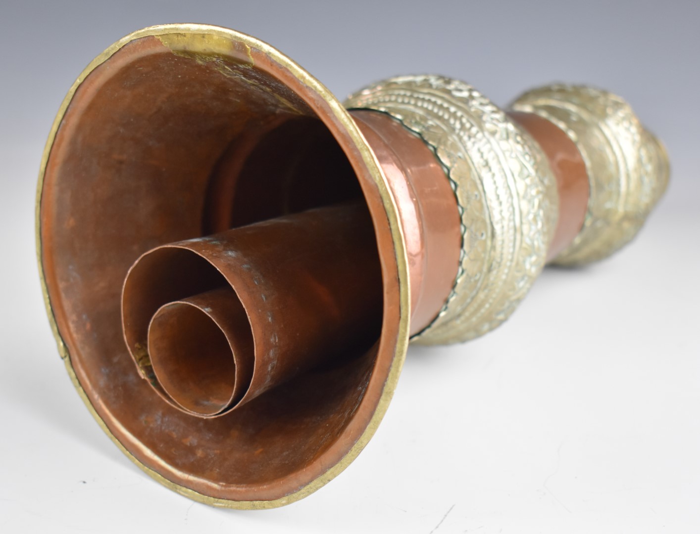 Tibetan copper horn, white metal and copper on brass charger with deity decoration and a pair of - Image 5 of 5