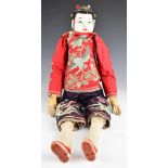 Large Chinese articulated doll with human hair queue / cue, embroidered jacket and bound feet,