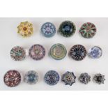Fifteen Perthshire, Strathearn and similar millefiori glass paperweights including faceted and