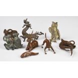 Collection of Japanese and Chinese bronze and cast metal animals including dragon, goat etc