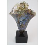Peter Layton iridescent glass vase mounted on a polished marble base, signed 'Peter Layton 1985'