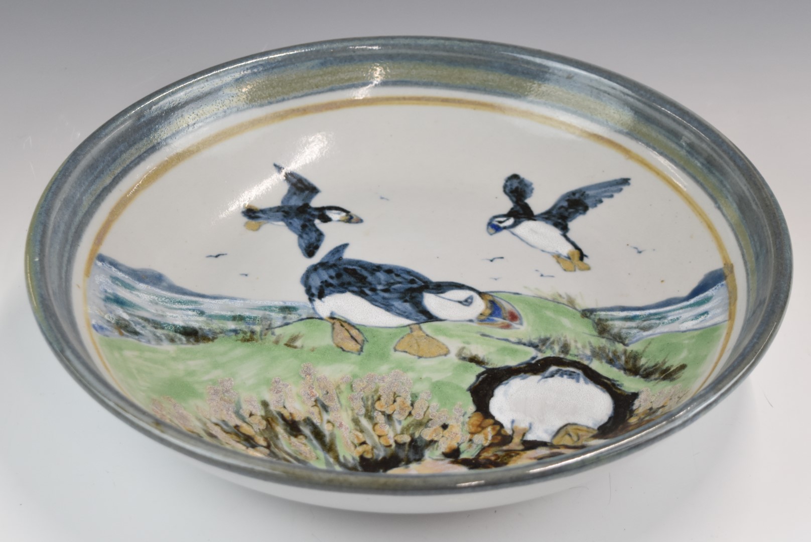 Highland Stoneware large pottery pedestal bowl decorated with puffins in flight returning to their - Image 2 of 4