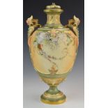 Royal Worcester blush ivory pedestal vase with twin mask handles, relief moulded detail and