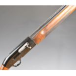 Beretta A301 12 bore three-shot semi-automatic shotgun with engraved locks, chequered semi-pistol