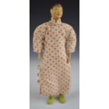 Chinese 'Door of Hope' doll wearing a red polka dot dress and under trousers, height 26.5cm