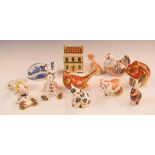 A collection of Royal Crown Derby paperweights including a house, cats, doll etc, tallest 10cm