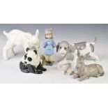 A collection of porcelain / ceramic figures including Russian calf, Copenhagen Polar Bear, Nao