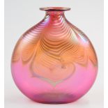 Correia American iridescent glass vase with pulled feather decoration on pink ground, signed '