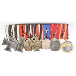 Group of seven German medals comprising WW1 Iron Cross and Cross of Honour with crossed swords,