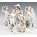 Seven Lladro figures and a Nao lady with bag, tallest 22cm