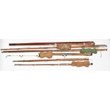 A collection of vintage fishing rods including sea fishing, cane etc