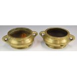A pair of Chinese 19th / 20thC twin handled pedestal bronze censers with six character marks to