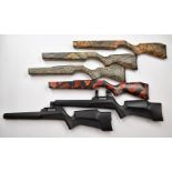 Six Nikko Stirling and Hawke stock blanks in various camouflage and similar finishes.
