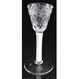 An 18thC cordial drinking glass with cotton twist stem and etched and cut glass bowl, 14.5cm tall.