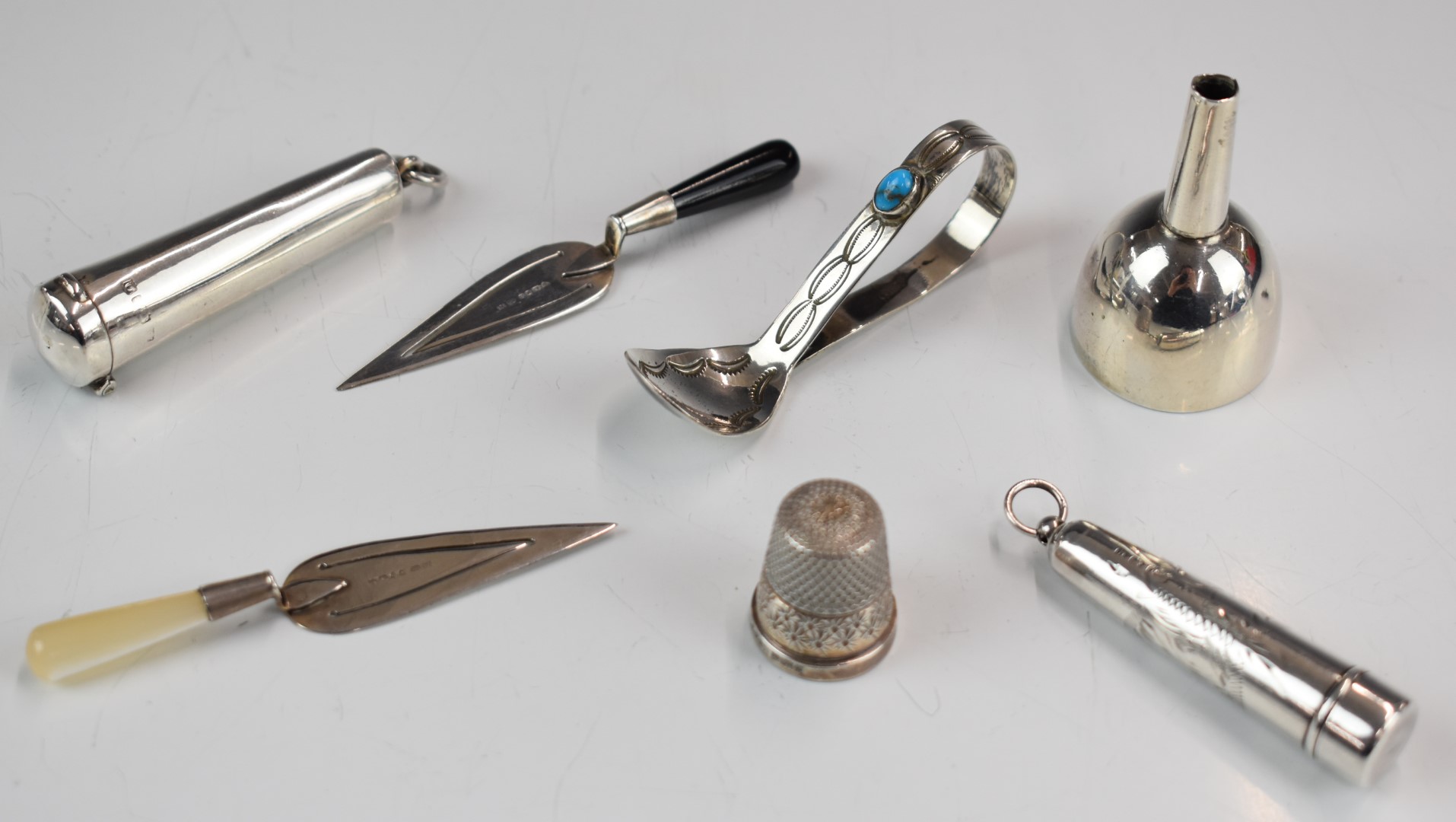 Small hallmarked silver items comprising two novelty bookmarks formed as trowels, Sampson Mordan &