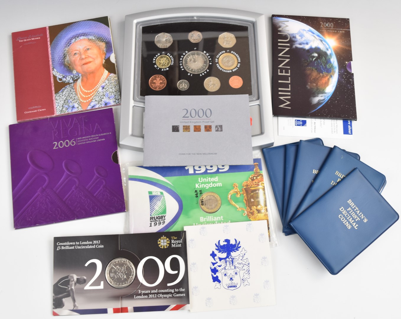 A collection of Royal Mint commemorative coinage comprising five Britain's First Decimal Coins,