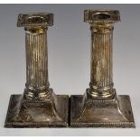 George V pair of hallmarked silver candlesticks formed as reeded columns, Sheffield 1921, maker