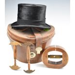 Silk top hat by Battersby and Co, London, in leather case with three vintage hat stretchers