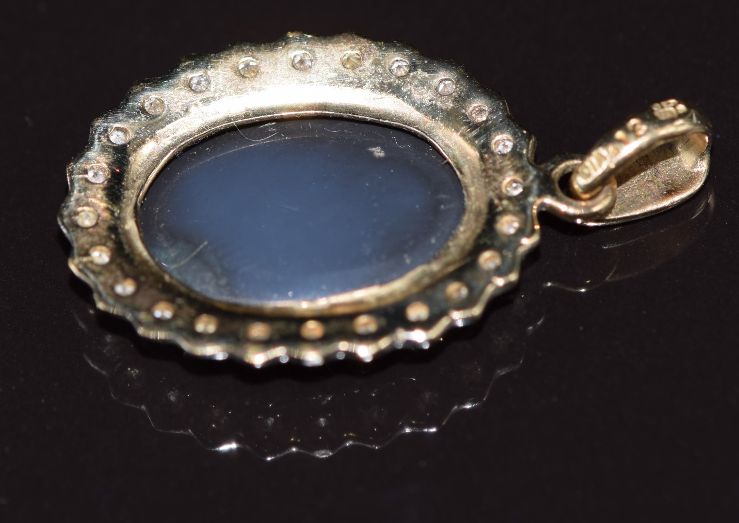 A 9ct gold pendant set with an opal surrounded by diamonds, 2.4g - Image 3 of 3