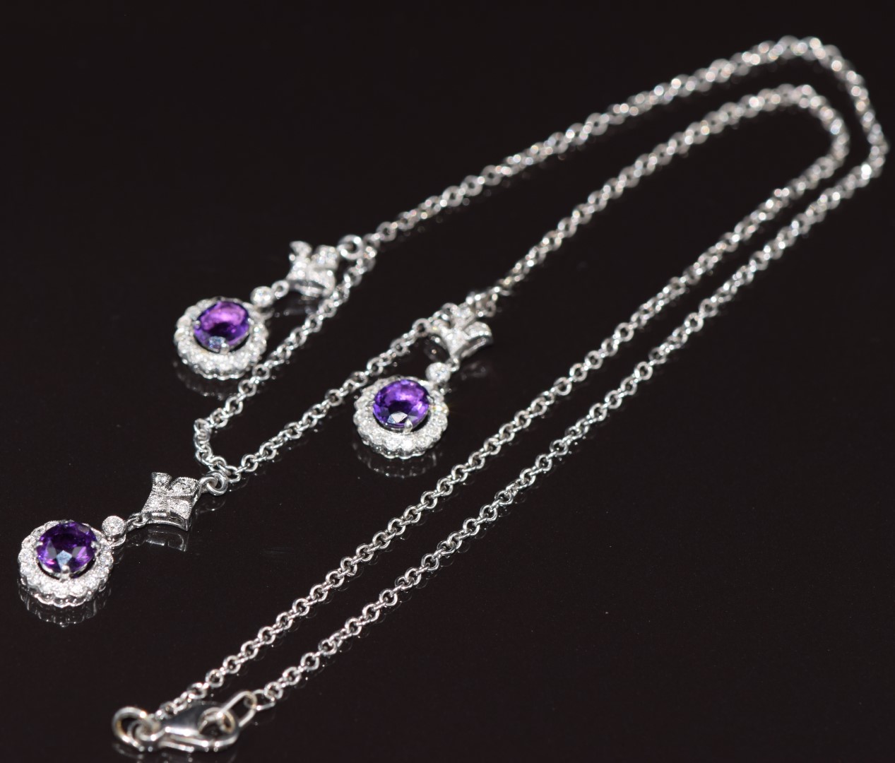 An 18ct white gold necklace with three drop sections set with oval cut amethysts and diamonds, 8.1g - Image 3 of 3