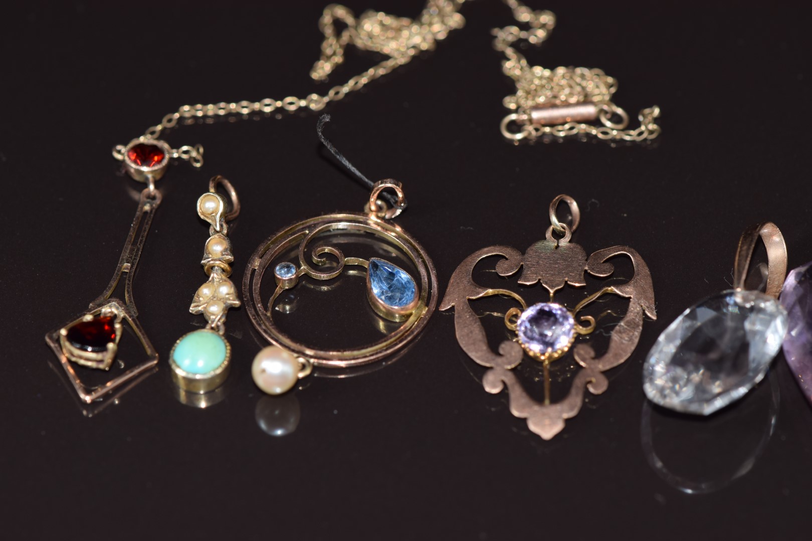 Four 9ct gold c1900 pendants set with turquoise, amethyst, garnets and paste (5g) together with an - Image 5 of 6