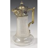 Cut glass claret jug with silver plated mount, hinged lid and mask decoration to the spout, height