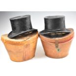 Two vintage top hats in leather cases, one Dunn & Co., London 19 x 15cm, the other marked 'superior'