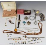 A collection of costume jewellery including earrings, silver fob watch, brooches, etc
