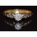 An 18ct gold ring set with a diamond in a platinum setting, 1.9g, size J/K