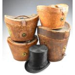 Four vintage leather hat cases or boxes including a double example, some with railway luggage