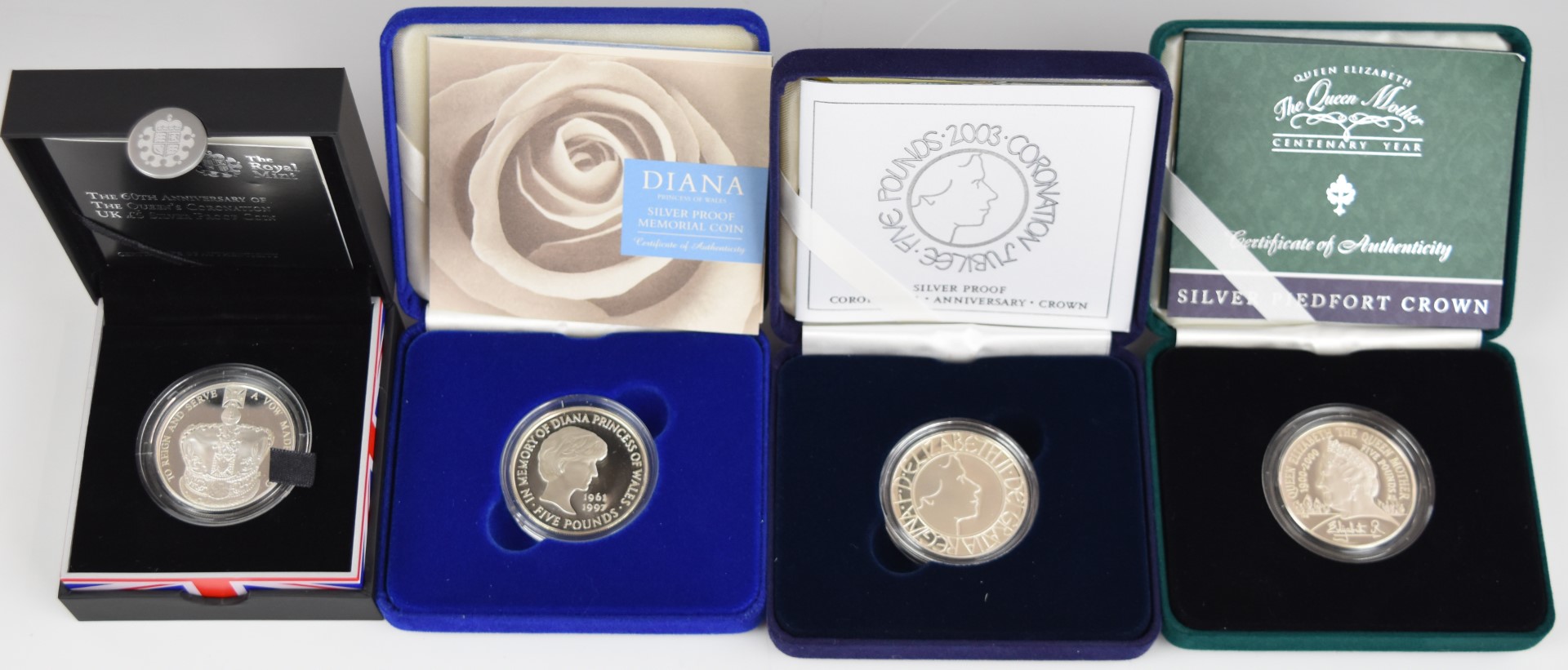 Four Royal Mint silver proof Royal commemorative crowns comprising a Queen Mother Centenary