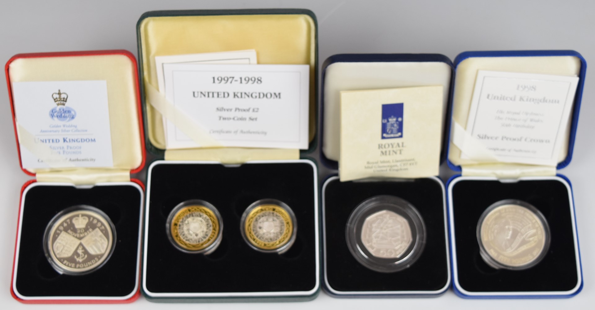 Five Royal Mint silver proof coins comprising a Golden Wedding crown, Prince of Wales 50th