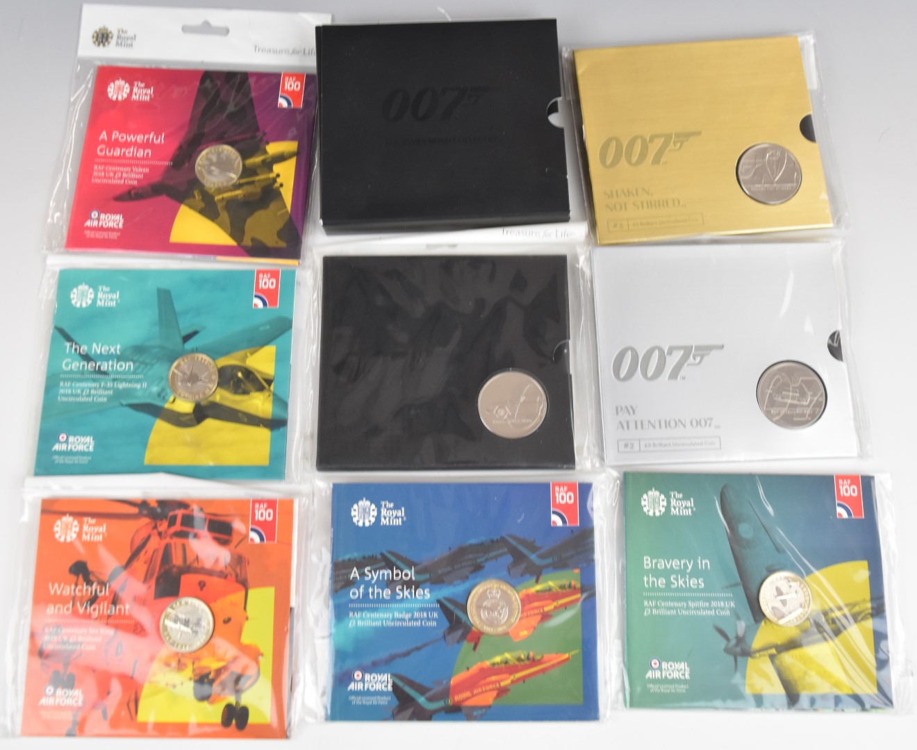 Five Royal Mint RAF commemorative £2 coin presentation packs, together with a set of three 007 James