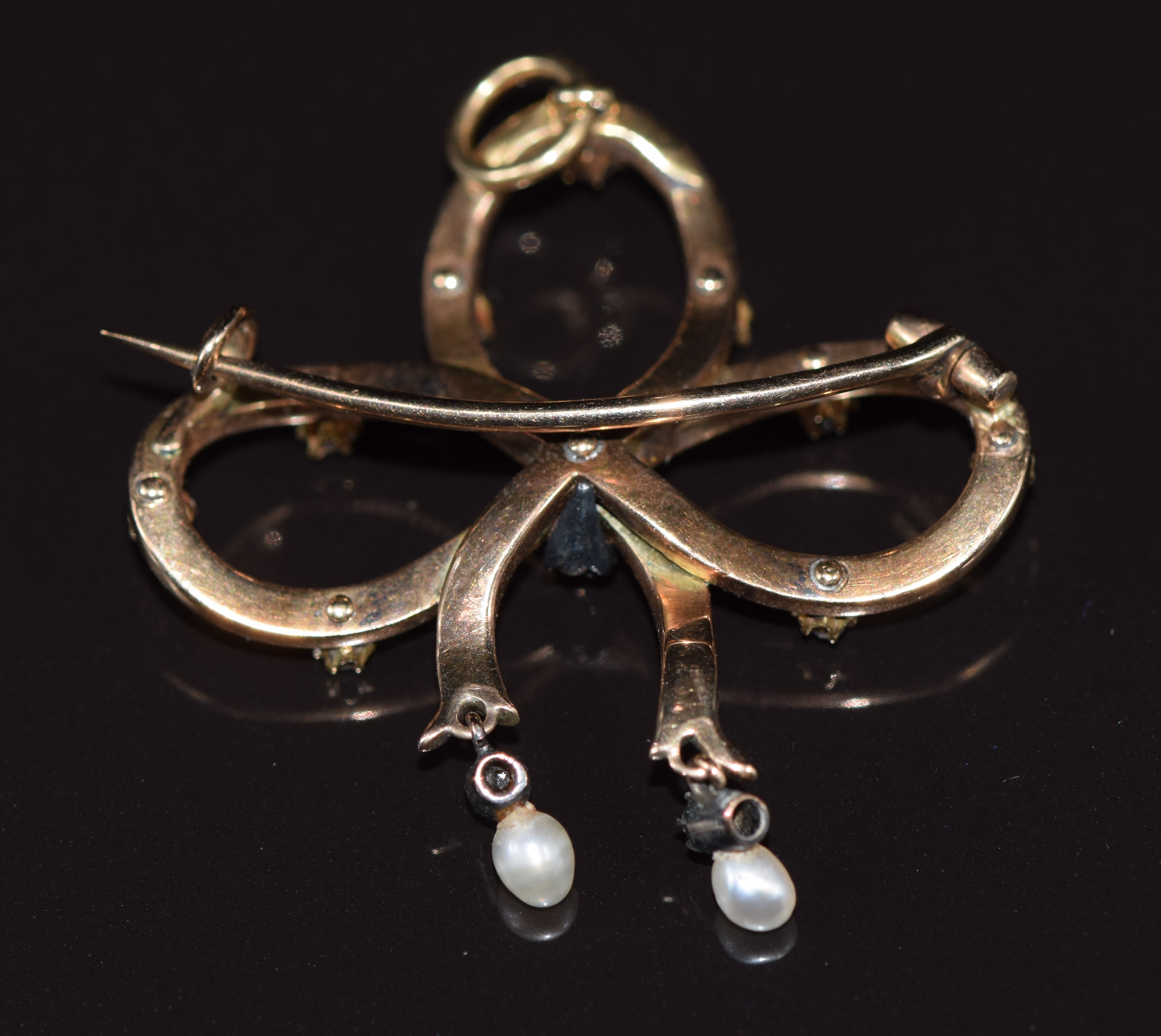 Victorian 9ct gold pendant/ brooch in the form of a bow set with enamel, diamonds and two drop - Image 2 of 2