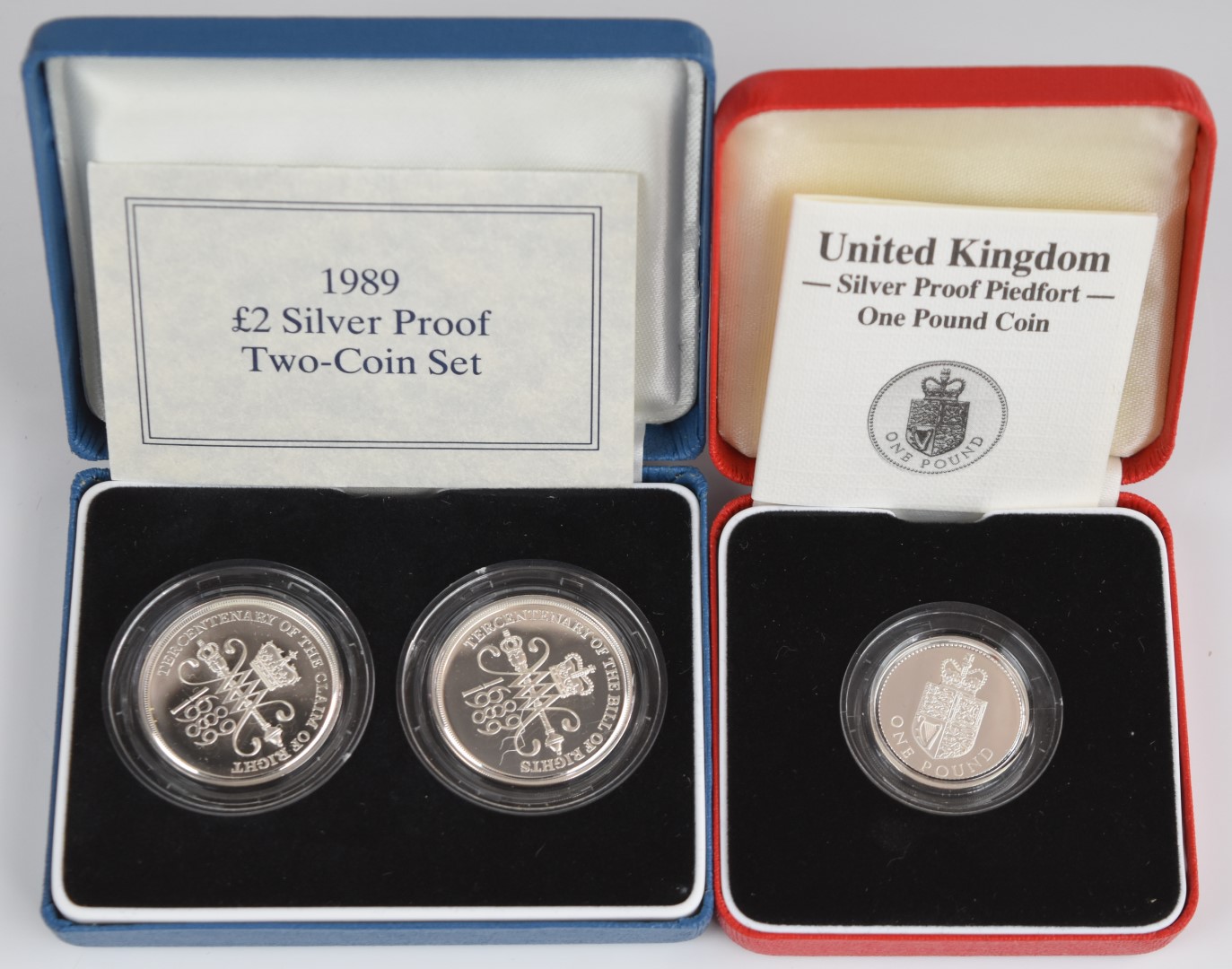 Three Royal Mint silver proof commemorative coins comprising 1989 £2 two coin set and a 1988 Royal