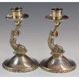 Pair of silver candlesticks with figural dolphin supports, marked to bases with 800 grade marks,